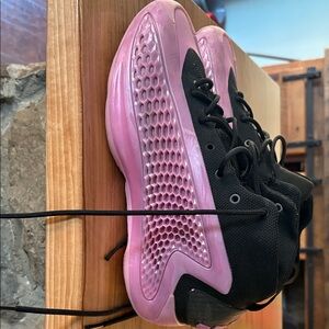 Black and Pink basketball shoes. Worn only in door for one season